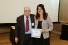Dr. Nagib Callaos, General Chair, giving Prof. Renata Maria Abrantes Baracho the best paper award certificate of the session "Case Studies and Methodologies II." The title of the awarded paper is "Information Modeling and Information Retrieval for the Internet of things (IoT) in Buildings."